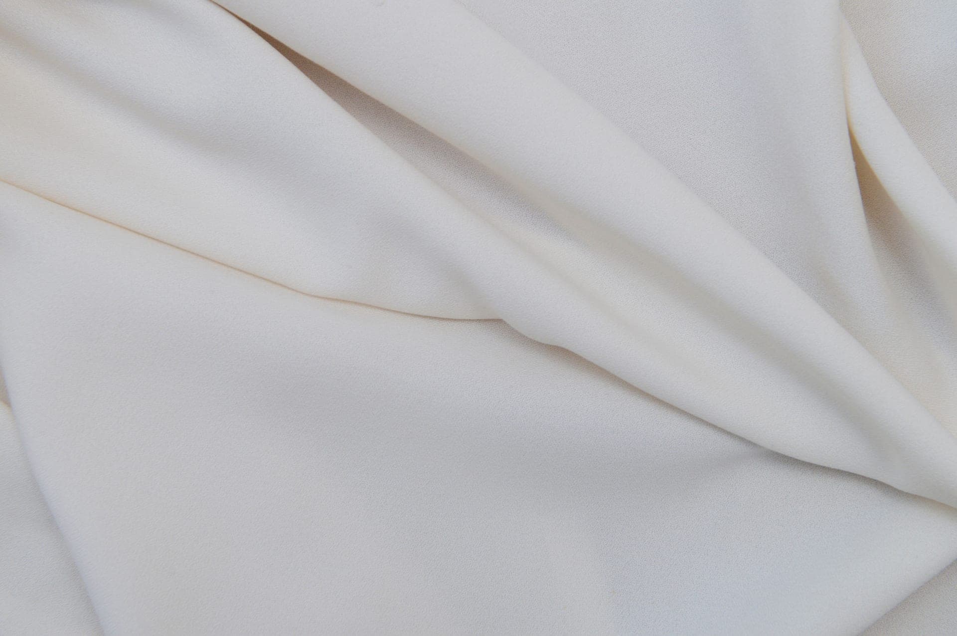 Close-up of white fabric with smooth folds