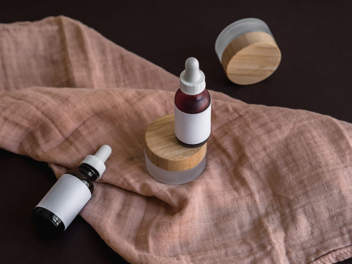 Korean skincare bottles arranged on a dark minimal surface
