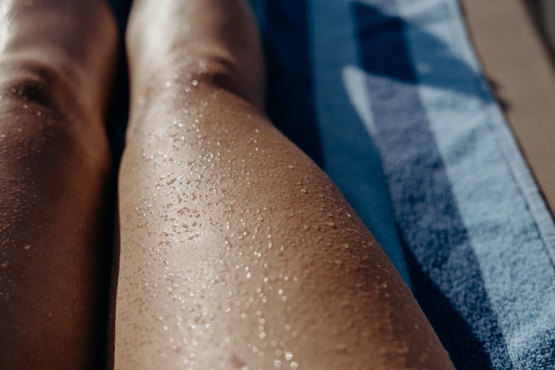 Legs resting on a towel